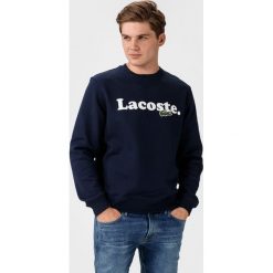 Lacoste Bluza Niebieski. Niebieskie bluzy męskie Lacoste, s, z nadrukiem, z bawełny, bez kołnierzyka, bez rękawów, bez kaptura. Za 581,95 zł.