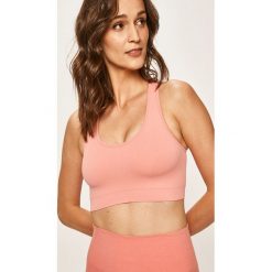 Cardio Bunny - Biustonosz sportowy Fire. Pomarańczowe biustonosze damskie termoaktywne Cardio Bunny, s, bez wzorów, z elastanu. W wyprzedaży za 79,90 zł.