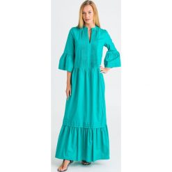 SUKIENKA twinset. Niebieskie sukienki damskie Twinset, na imprezę, bez wzorów, z elastanu, z włoskim kołnierzykiem, bez rękawów, maxi. Za 989,00 zł.