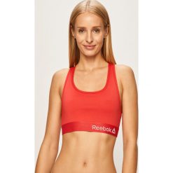 Reebok - Biustonosz sportowy. Różowe biustonosze sportowe damskie Reebok, s, bez wzorów, z elastanu. W wyprzedaży za 69,90 zł.