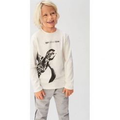 Mango Kids - Longsleeve dziecięcy Oceans 110-164 cm. Białe t-shirty chłopięce Mango Kids, z nadrukiem, z bawełny, bez rękawów. Za 45,90 zł.