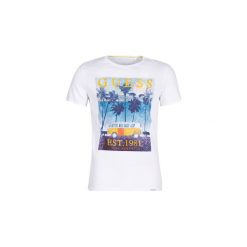 T-shirty z krótkim rękawem Guess ON TOUR. Białe t-shirty męskie marki Guess, s, z aplikacjami, bez kołnierzyka, krótkie. Za 179,00 zł.