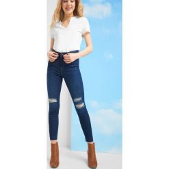Jeansy skinny z dziurami. Niebieskie jeansy damskie Orsay, bez wzorów, z elastanu, eleganckie, z podwyższonym stanem. Za 89,99 zł.