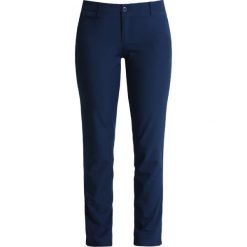Chinosy damskie: Under Armour LINKS Chinosy academy