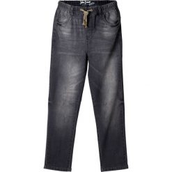 Dżinsy "used look" Slim Fit bonprix szary denim. Szare spodnie chłopięce bonprix, bez wzorów, z jeansu. Za 74,99 zł.