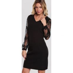 Czarna Sukienka In Sooth. Czarne sukienki damskie other, xl, bez wzorów, bez kołnierzyka, bez rękawów, midi. Za 89,99 zł.