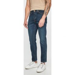 Wrangler - Jeansy Slider. Niebieskie jeansy męskie Wrangler, bez wzorów. W wyprzedaży za 229,90 zł.