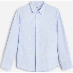 Bawełniana koszula slim fit -. Koszule męskie Reserved, bez wzorów, z bawełny, bez kołnierzyka, bez rękawów. Za 69,99 zł.