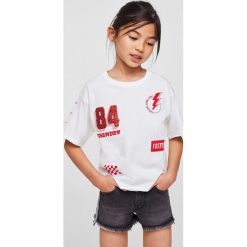 Mango Kids - Szorty dziecięce Stripe 116-164 cm. Szare spodenki dziewczęce marki Mango Kids, z aplikacjami, z elastanu, casualowe. Za 79,90 zł.