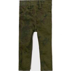 Name it - Legginsy dziecięce 80-110 cm. Pomarańczowe spodnie dziewczęce Name it, bez wzorów, z elastanu. W wyprzedaży za 39,90 zł.