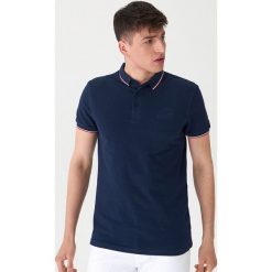 Koszulka polo z haftem - Granatowy. Niebieskie koszulki męskie House, s, z haftami, polo, bez rękawów. Za 59,99 zł.