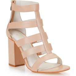 Buty damskie. Żółte klapki damskie Wittchen, bez wzorów, ze skóry, na wysokim obcasie, na słupku. W wyprzedaży za 199,90 zł.