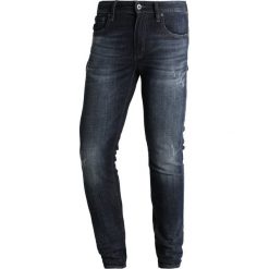 Superdry Jeans Skinny Fit new wave. Niebieskie jeansy męskie relaxed fit marki Superdry, z bawełny. W wyprzedaży za 343,20 zł.