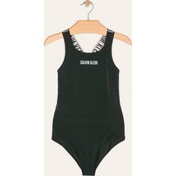 Calvin Klein - Strój kąpielowy dziecięcy 128-176 cm. Pomarańczowe stroje kąpielowe dziewczęce Calvin Klein, bez wzorów, z elastanu. W wyprzedaży za 199,90 zł.
