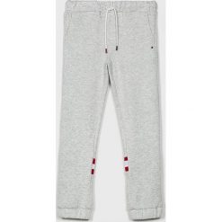 Tommy Hilfiger - Spodnie dziecięce 128-176 cm. Szare spodnie dziewczęce TOMMY HILFIGER, bez wzorów, z bawełny, casualowe. W wyprzedaży za 179,90 zł.