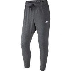Nike NSW Pant CF JSY Club 804461-071. Szare spodnie męskie Nike, s, bez wzorów, z bawełny. W wyprzedaży za 159,99 zł.