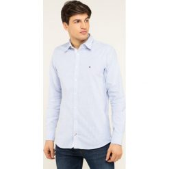Koszula TOMMY HILFIGER MW0MW04964. Niebieskie koszule męskie TOMMY HILFIGER, xl, bez wzorów, z elastanu, casualowe, bez kołnierzyka, bez rękawów. W wyprzedaży za 219,00 zł.