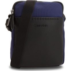 Saszetka CALVIN KLEIN - Multi Task Mini Repo K50K503782 447. Niebieskie torby męskie skórzane Calvin Klein, bez wzorów, ze skóry ekologicznej, młodzieżowe. W wyprzedaży za 249,00 zł.