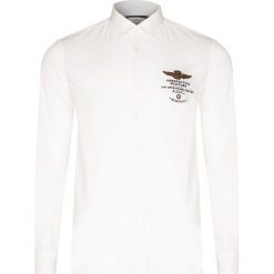 Koszula AERONAUTICA MILITARE. Niebieskie koszule męskie Aeronautica Militare, z aplikacjami, z bawełny, klasyczne, z włoskim kołnierzykiem, bez rękawów. Za 520,00 zł.