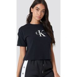Calvin Klein T-shirt Teco True Icon - Black. Czarne t-shirty damskie marki Calvin Klein, z nadrukiem, z bawełny, bez kołnierzyka. Za 202,95 zł.