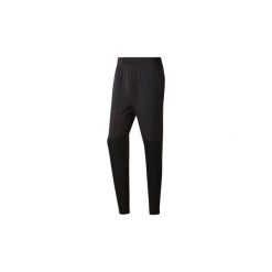 Spodnie treningowe Reebok Sport Spodnie Training Woven Trackster. Czarne spodnie męskie Reebok Sport, s, bez wzorów, sportowe. Za 160,30 zł.