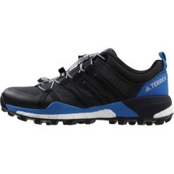 Adidas Performance TERREX SKYCHASER Obuwie hikingowe black/carbon. Czarne buty sportowe męskie marki adidas Performance, z tworzywa sztucznego, bez zapięcia, outdoorowe. W wyprzedaży za 559,20 zł.
