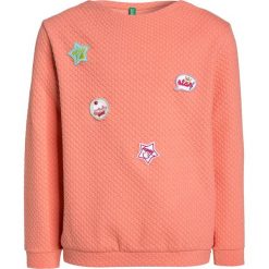 Benetton Bluza apricot. Pomarańczowe bluzy chłopięce marki Benetton, z bawełny. W wyprzedaży za 125,10 zł.