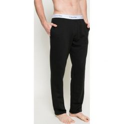 Calvin Klein Underwear - Spodnie piżamowe. Czarne piżamy męskie Calvin Klein Underwear, na co dzień, s, bez wzorów, z elastanu. Za 249,90 zł.