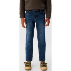 Mango Kids - Jeansy dziecięce Jacob 10-164 cm. Niebieskie spodnie chłopięce Mango Kids, z aplikacjami, z elastanu. W wyprzedaży za 59,90 zł.