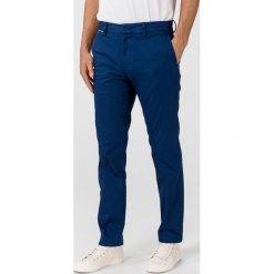 Tommy Hilfiger Denton Spodnie Niebieski. Niebieskie spodnie męskie TOMMY HILFIGER, bez wzorów, z elastanu. Za 514,95 zł.