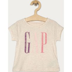 GAP - T-shirt dziecięcy 80-110 cm. Różowe bluzki dziewczęce GAP, z nadrukiem, z bawełny, z okrągłym kołnierzem, z krótkim rękawem, krótkie, bez kaptura. Za 69,90 zł.