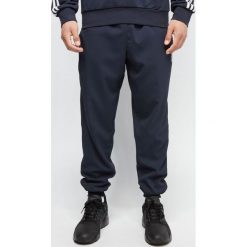 Spodnie dresowe męskie adidas granat. Niebieskie spodnie męskie Adidas, s, bez wzorów, z elastanu. Za 139,90 zł.