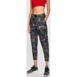 Nike - Spodnie. Spodnie damskie Nike, s, bez wzorów, z poliesteru, dri-fit (nike). W wyprzedaży za 159,90 zł.