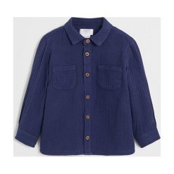 Mango Kids - Koszula dziecięca Edu 80-104 cm. Niebieskie koszule chłopięce Mango Kids, bez wzorów, z bawełny, casualowe, bez kołnierzyka, z długim rękawem, długie. W wyprzedaży za 55,90 zł.