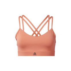 Biustonosze Reebok Sport Biustonosz Hero Strappy Padded. Różowe biustonosze sportowe damskie marki Reebok Sport, s, bez wzorów. Za 129,00 zł.