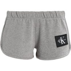 Boyfriendy damskie: Calvin Klein Jeans TRUE ICON TRACK Spodnie treningowe light grey heather