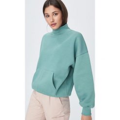 BLUZA DAMSKA - Turkusowy. Niebieskie bluzy damskie Sinsay, s, bez wzorów, bez rękawów, bez kaptura. Za 49,99 zł.