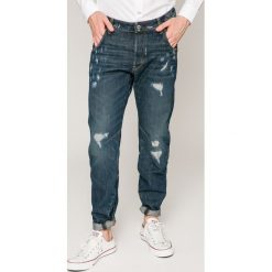 G-Star Raw - Jeansy Arc. Niebieskie jeansy męskie z dziurami marki G-Star RAW. W wyprzedaży za 399,90 zł.