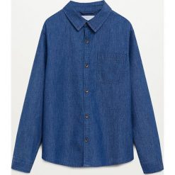 Mango Kids - Koszula bawełniana dziecięca Daniel 110-164 cm. Niebieskie koszule chłopięce Mango Kids, bez wzorów, z bawełny, casualowe, bez kołnierzyka, z długim rękawem, długie. Za 69,99 zł.