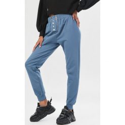 Niebieskie Spodnie Ynisienne. Niebieskie spodnie damskie Born2be, s, z dresówki. Za 69,99 zł.