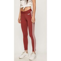 Adidas - Legginsy. Czerwone spodnie damskie Adidas, s, z aplikacjami, z elastanu. Za 129,90 zł.