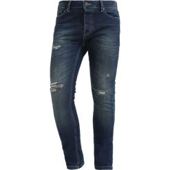 Topman Jeans Skinny Fit dark blue denim. Niebieskie jeansy męskie marki Topman. W wyprzedaży za 171,75 zł.