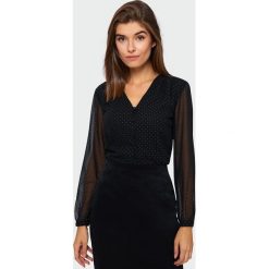 Elegancka bluzka z połyskującym wzorem - 46. Bluzki damskie e-margeritka.pl, bez wzorów, z tkaniny, eleganckie, bez kołnierzyka, bez rękawów, ołówkowe. Za 99,99 zł.