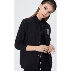 Bluza Harry Potter ze świecącym nadrukiem - Czarny. Czarne bluzy damskie Sinsay, s, z nadrukiem, bez rękawów, bez kaptura. Za 79,99 zł.