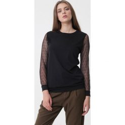 Czarna Bluzka Dolores. Czarne bluzki damskie Born2be, xl, bez wzorów, z dzianiny, z okrągłym kołnierzem, bez rękawów. Za 49,99 zł.