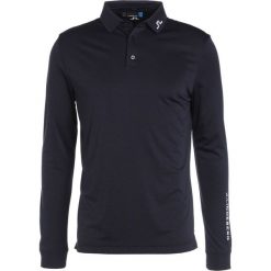 J.LINDEBERG TOUR TECH SLIM Koszulka polo navy melange. Niebieskie koszulki polo męskie marki J.LINDEBERG, l, z materiału. W wyprzedaży za 265,30 zł.