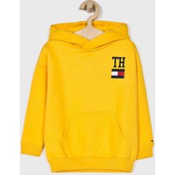 Tommy Hilfiger - Bluza dziecięca 104-176 cm. Żółte bluzy dziewczęce TOMMY HILFIGER, z nadrukiem, z bawełny, bez rękawów, z kapturem. W wyprzedaży za 179,90 zł.
