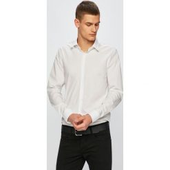 Calvin Klein - Koszula. Czarne koszule męskie Calvin Klein, bez wzorów, z elastanu, klasyczne, z klasycznym kołnierzykiem, z długim rękawem. W wyprzedaży za 199,90 zł.