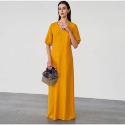 Żakardowa sukienka maxi - Żółty. Żółte sukienki damskie Reserved, s, bez wzorów, z żakardem, bez kołnierzyka, bez rękawów, maxi. Za 249,99 zł.