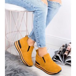 Botki damskie Bestelle RQ203 Żółte. Żółte botki damskie Bestelle, z tworzywa sztucznego, sportowe, bez obcasa, na koturnie, bez zapięcia. Za 139,00 zł.
